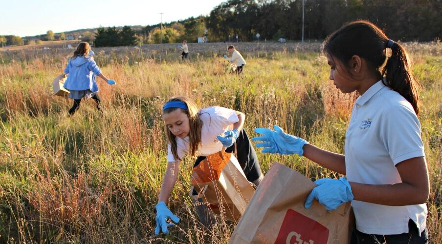 Kids pick prairie seeds